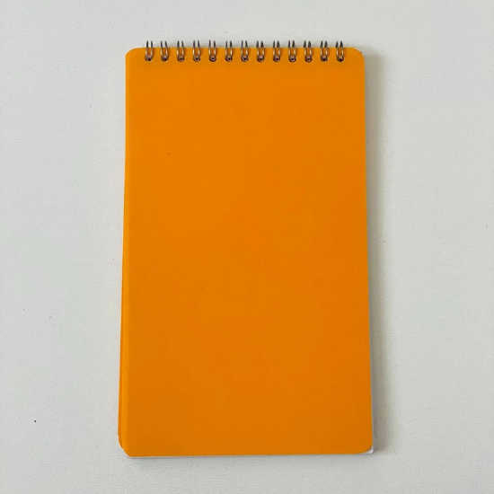 تصویر  دفترچه یادداشت جلد طلقی رنگی (فنر بالا) 13*22 سانتی متر